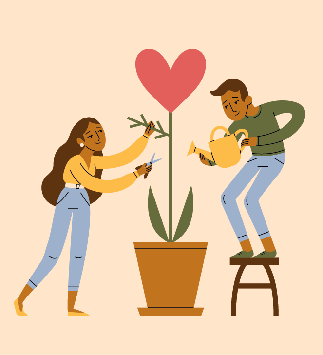 two people watering a plant with a heart growing out of it